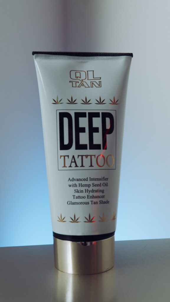 Ql Tan Deep Tattoo Cosmetic Display At Solaris Tanning Studio Reception Area
